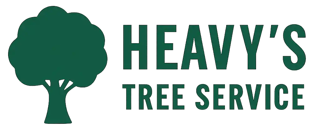 Heavy's Tree Service logo featuring a silhouette of a deciduous tree next to the company name.